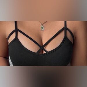 Black front criss cross cami top. Selling because I lost weight,doesnt fit me.